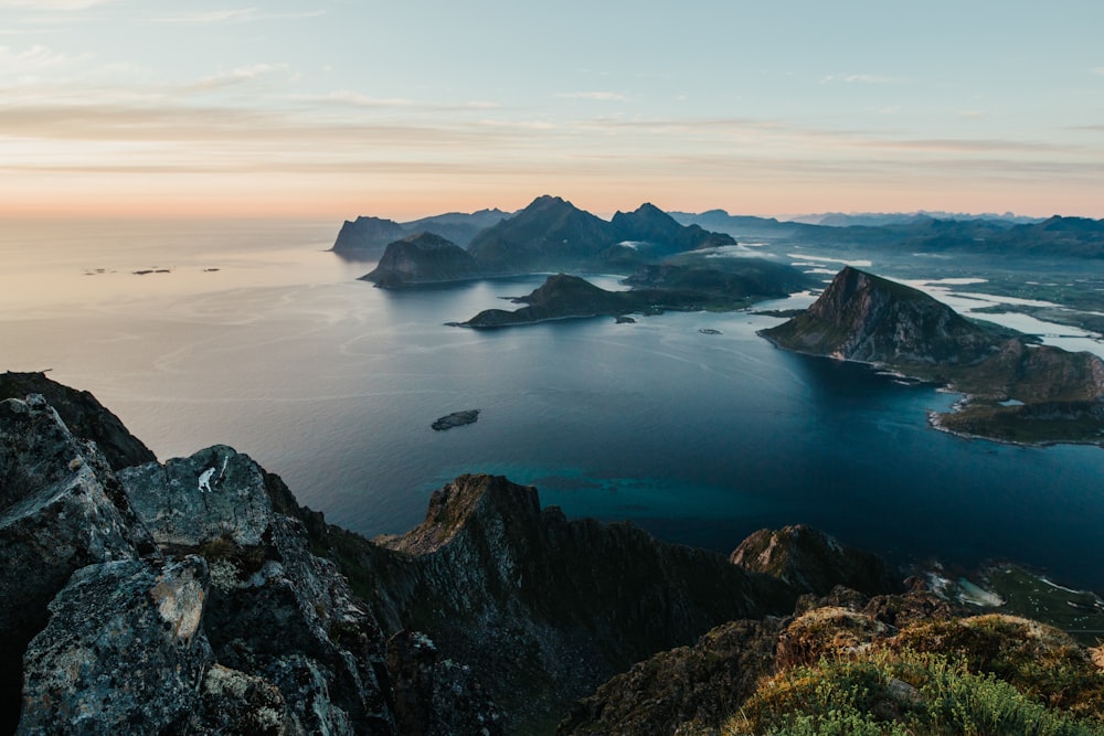 aerial view of mountain near body of water during daytime