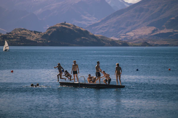 A family on a boat on a calm lake