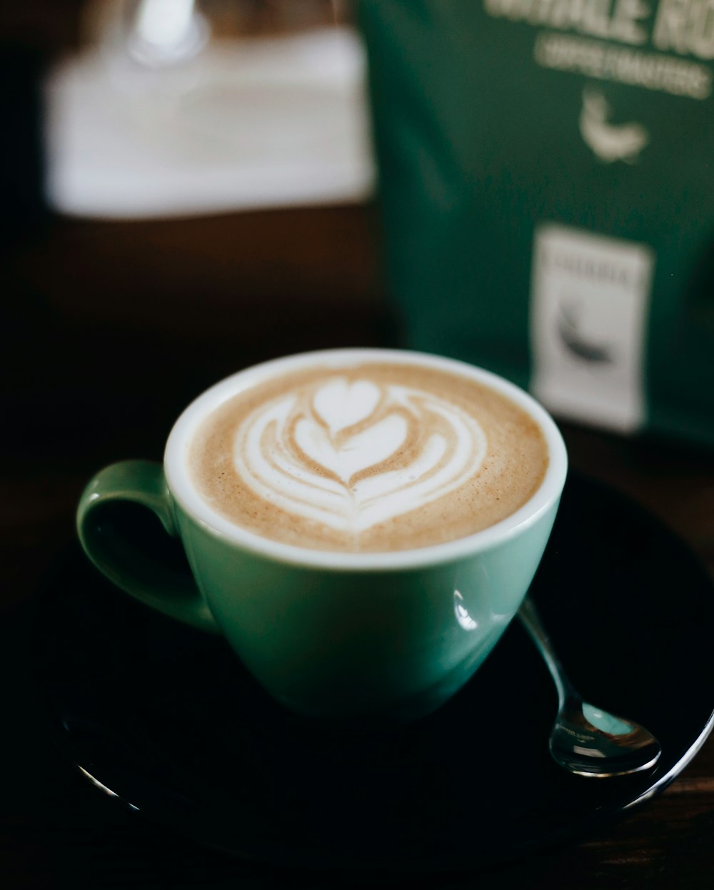 green ceramic mug with coffee