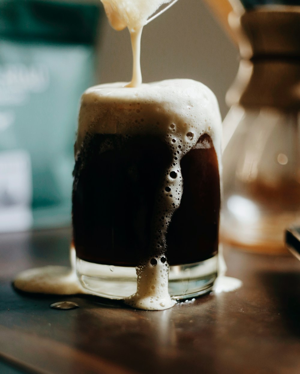 clear drinking glass with black liquid