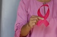 woman in pink and white polka dot shirt