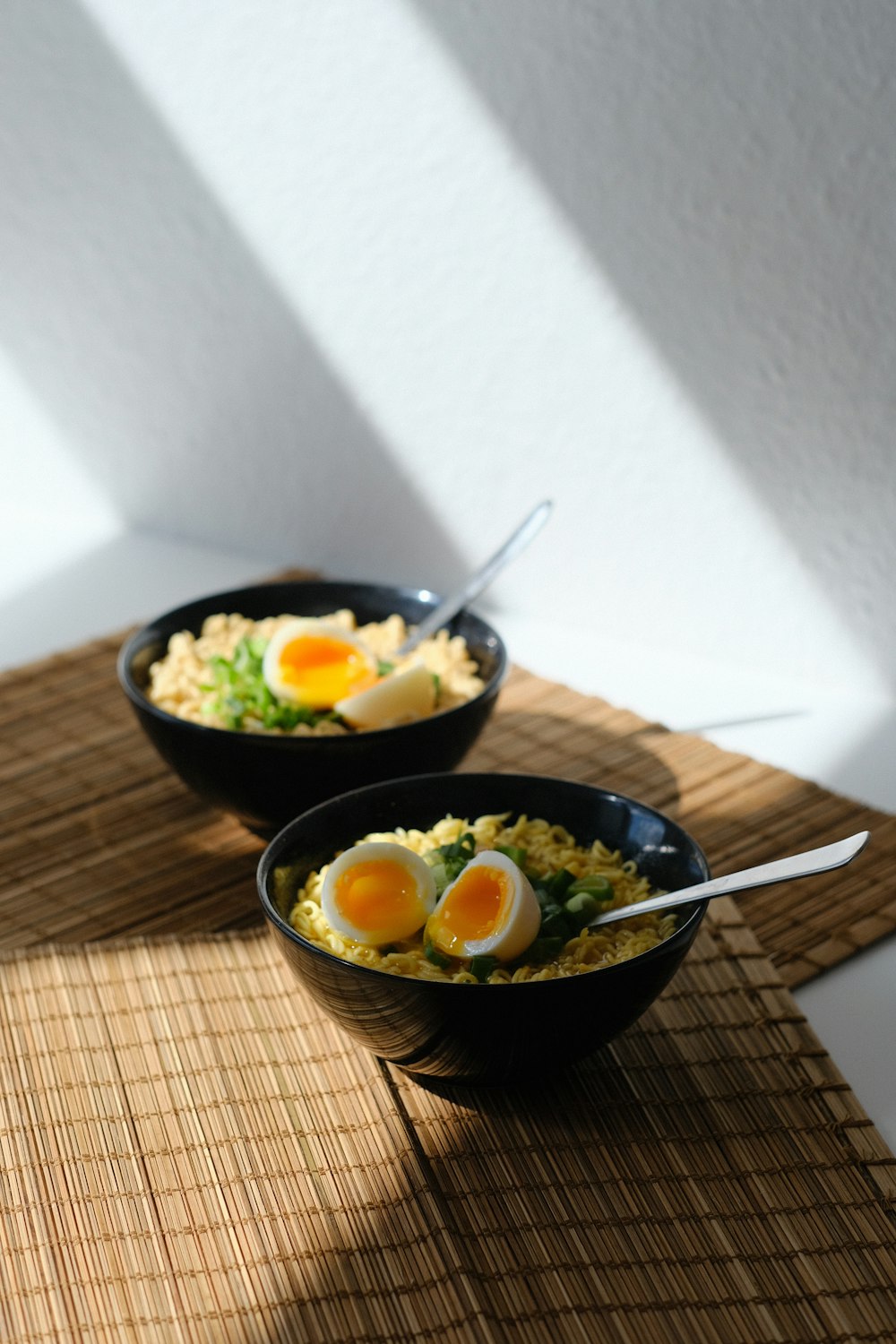 black ceramic bowl with stainless steel spoon