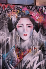 Artists from North-East India and Japan collaborating on a mural.