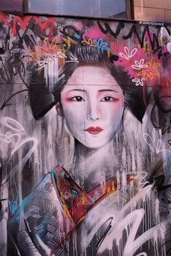 Artists from North-East India and Japan collaborating on a mural.