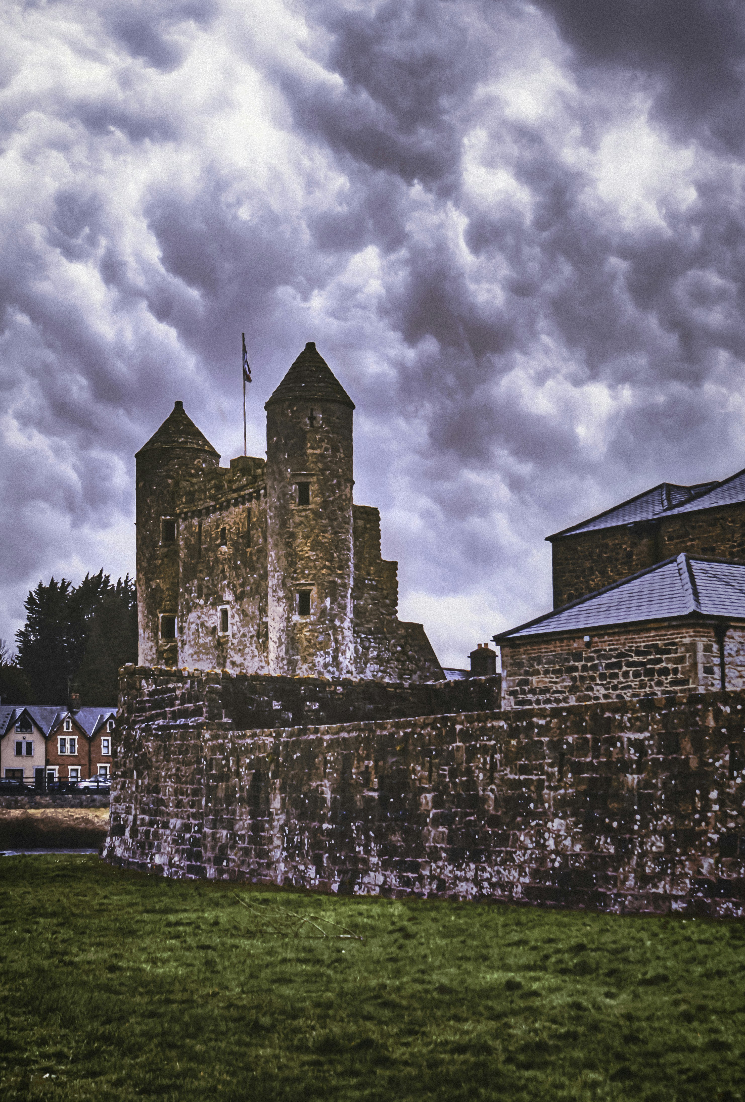 brown brick building under cloudy sky
