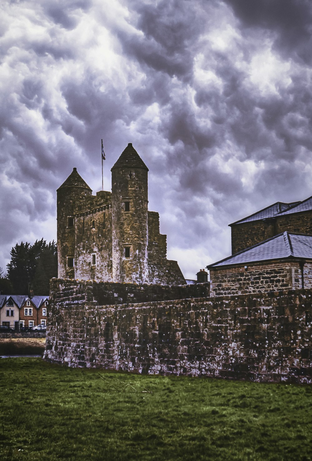 brown brick building under cloudy sky