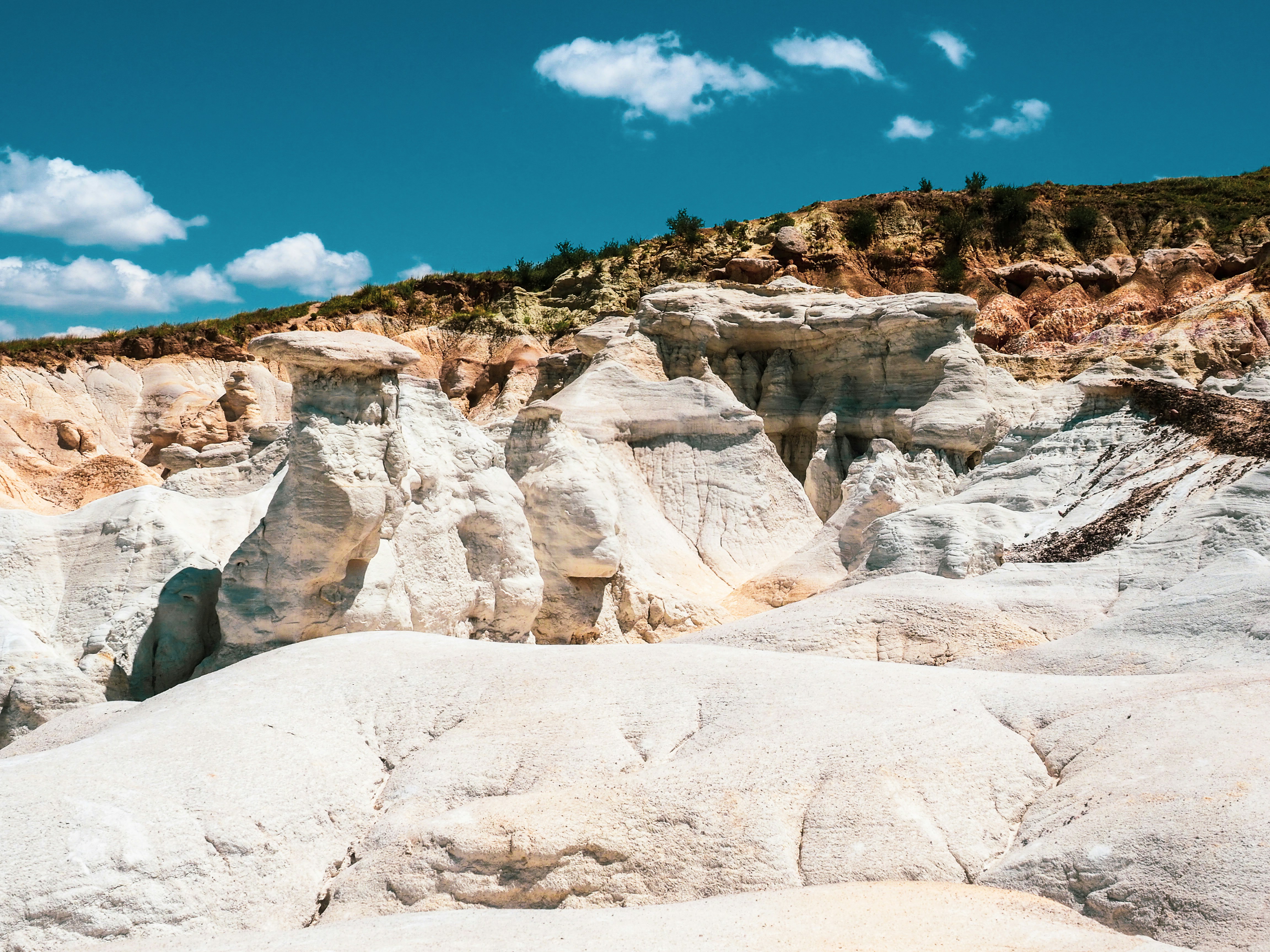 white and brown rocky mountain under blue sky during daytime