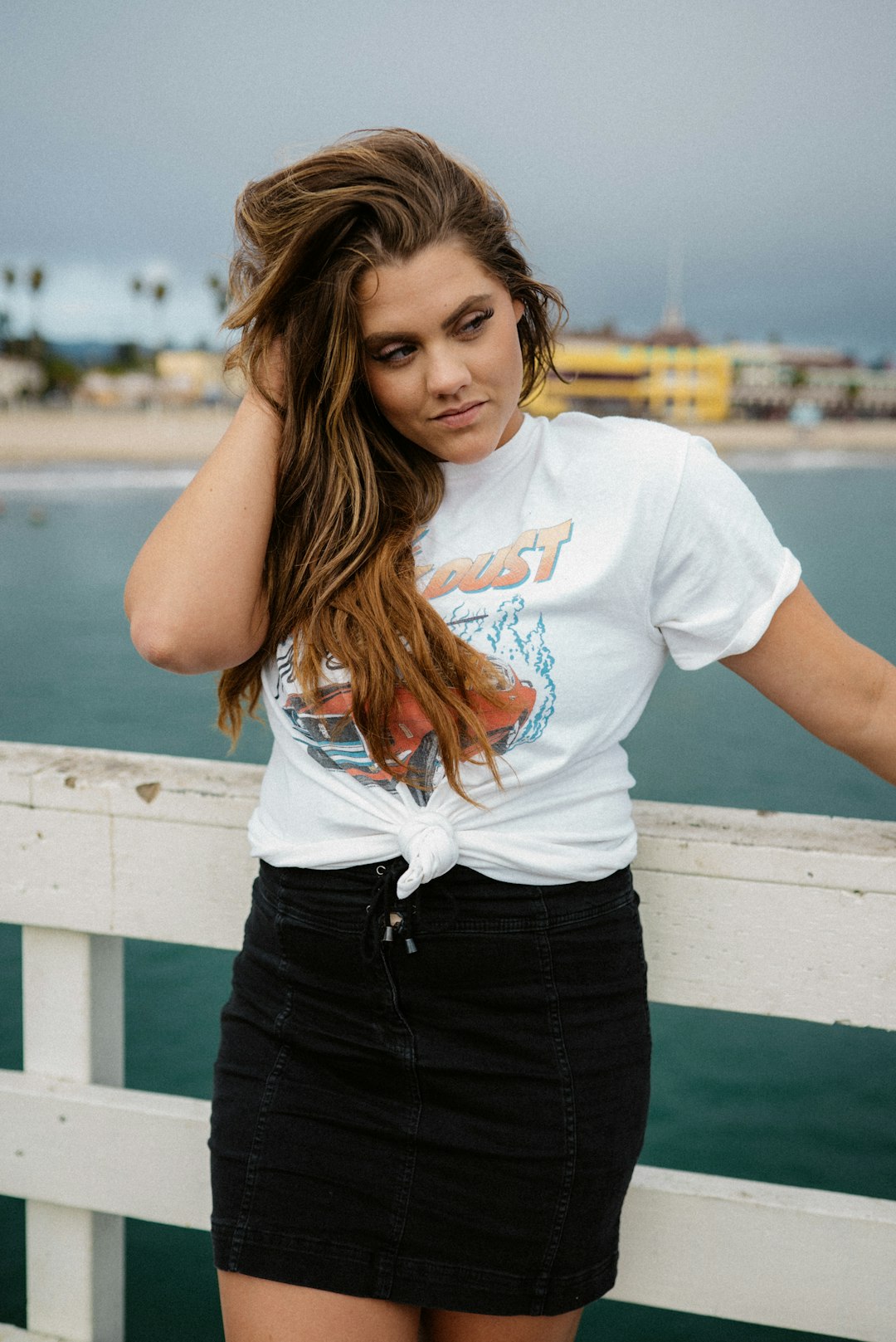 woman in white t-shirt and black skirt