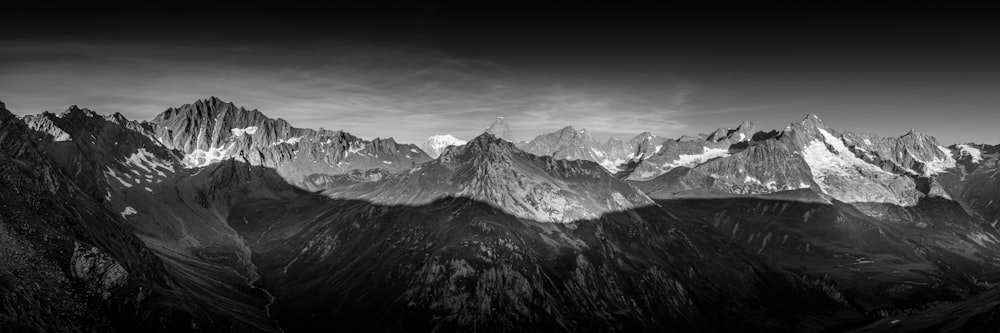 snow covered mountain during daytime