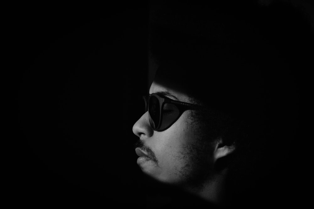 grayscale photo of man wearing sunglasses