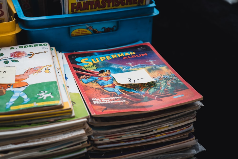 a stack of children's books sitting on top of a table