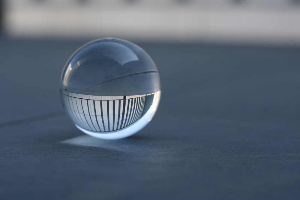 white and blue ball on white surface