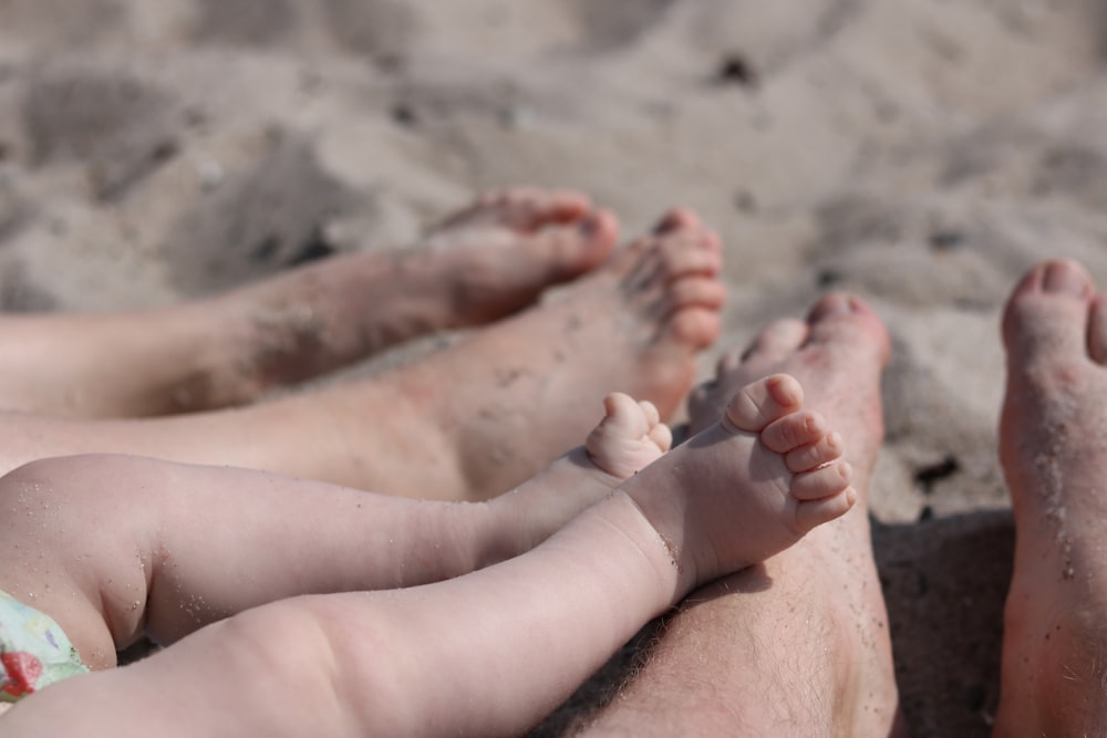 persons feet on sand