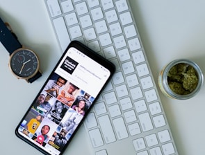black iphone 5 on white computer keyboard
