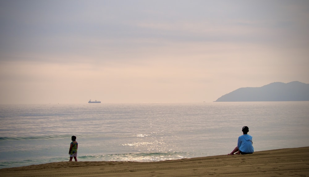 people walking on beach during daytime