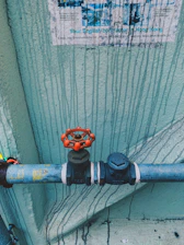 black and orange metal pipe