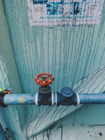 black and orange metal pipe