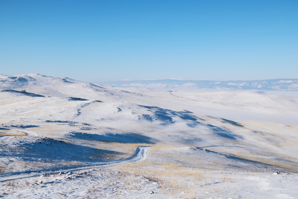 brown and white mountains under blue sky during daytime