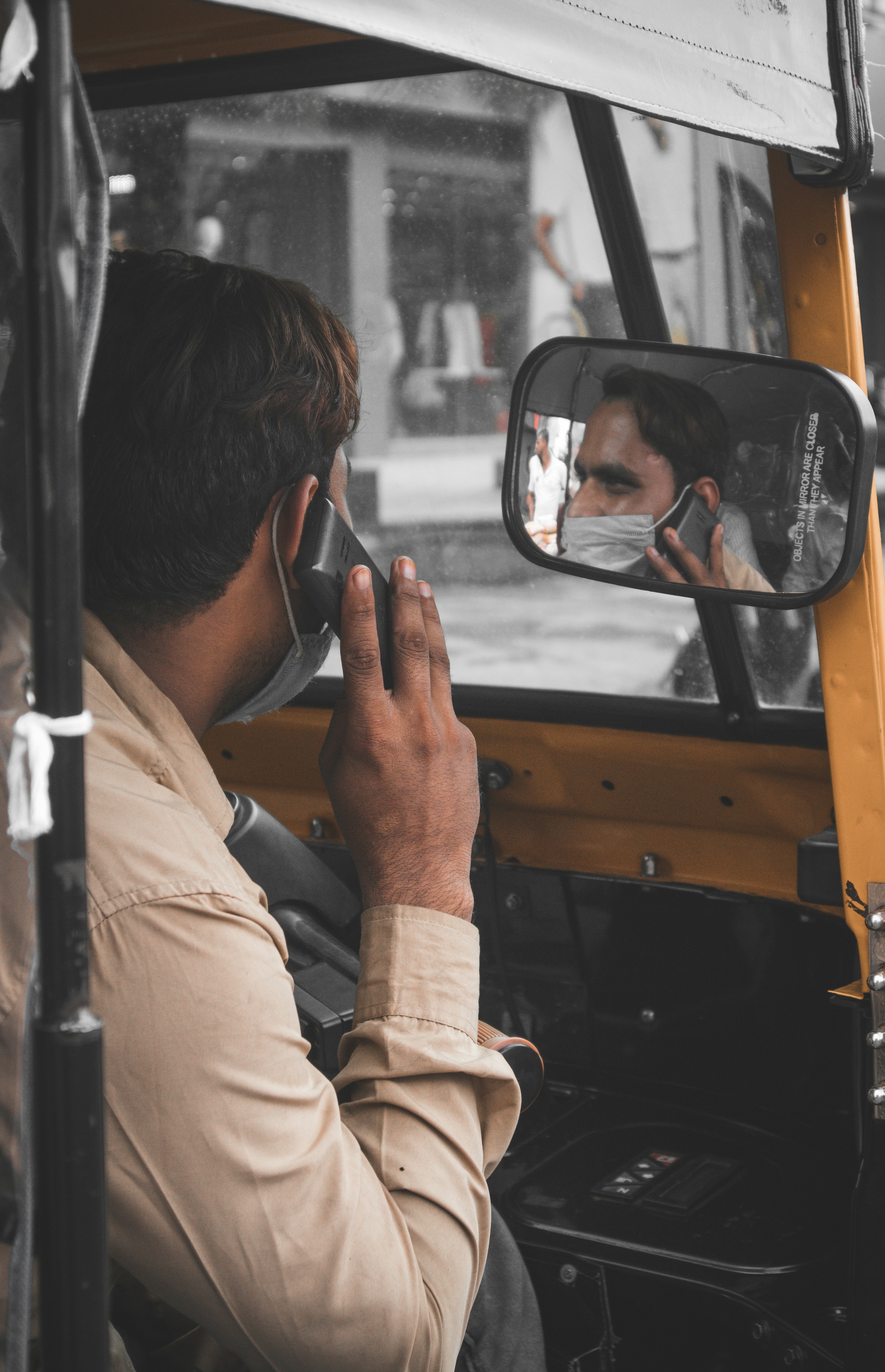 man in brown jacket wearing black sunglasses