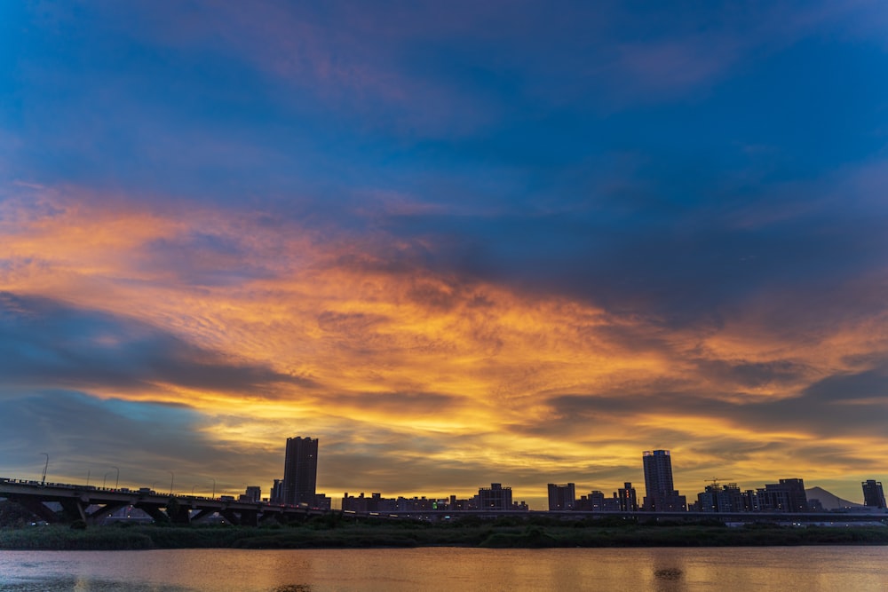 city skyline during orange sunset