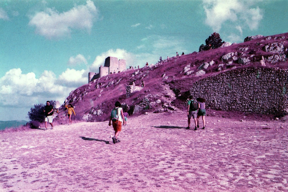 people walking on white sand during daytime