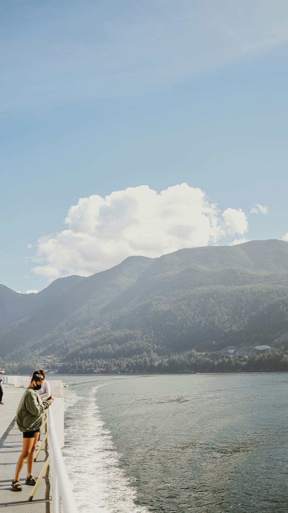 2 person sitting on white boat on sea during daytime