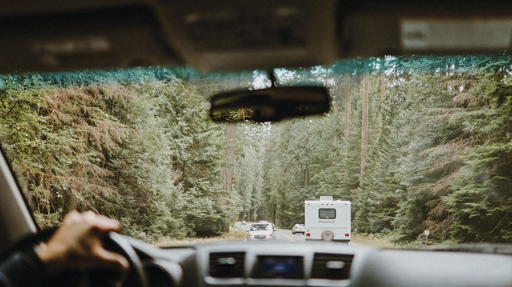 white and black cars on road during daytime