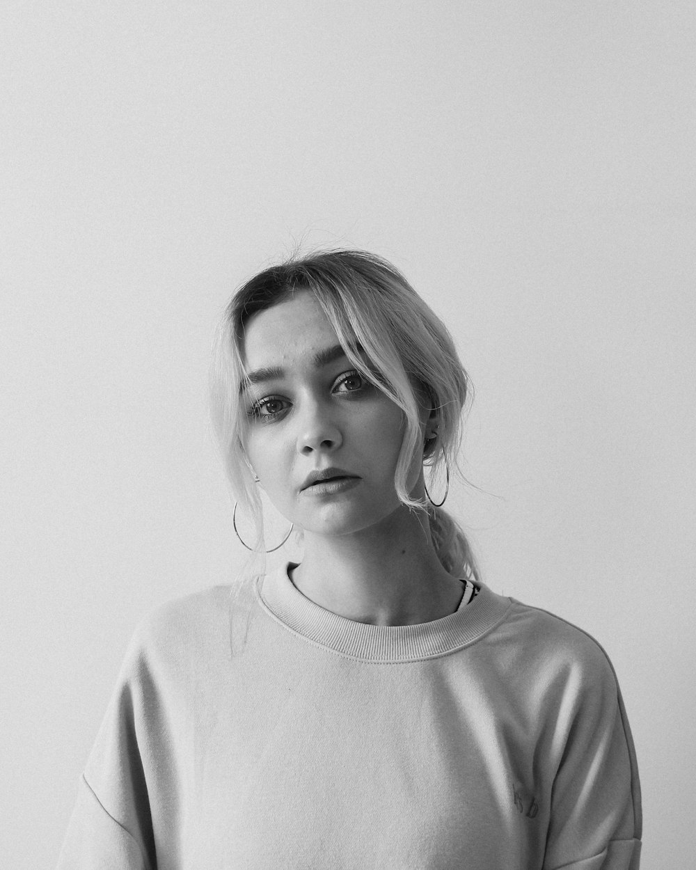 grayscale photo of girl in crew neck shirt