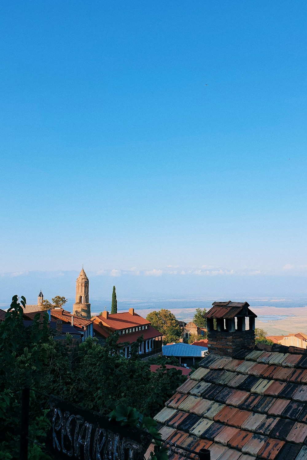 brown and black houses under blue sky during daytime