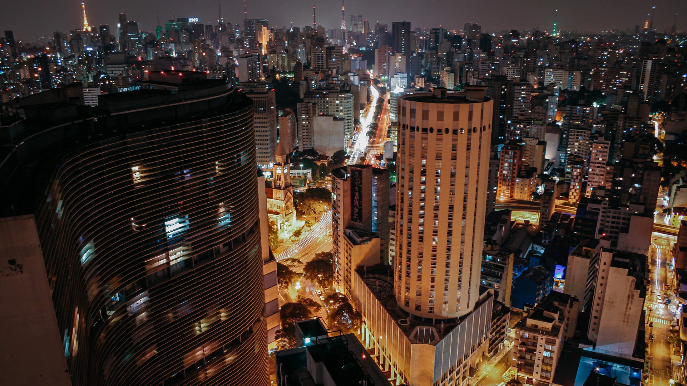 São Paulo skyline at night, Avenida Paulista lit through endless towers