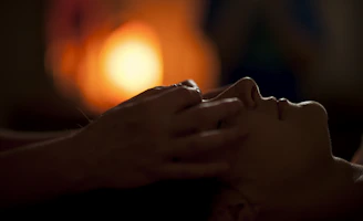 persons hand on top of sun