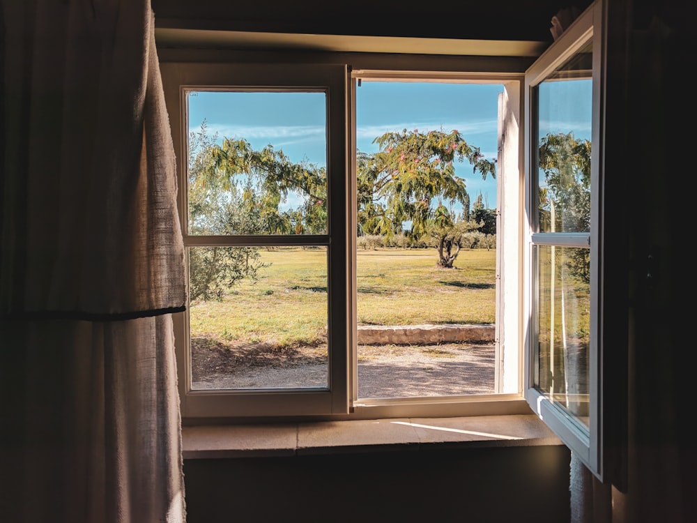 white wooden framed glass window