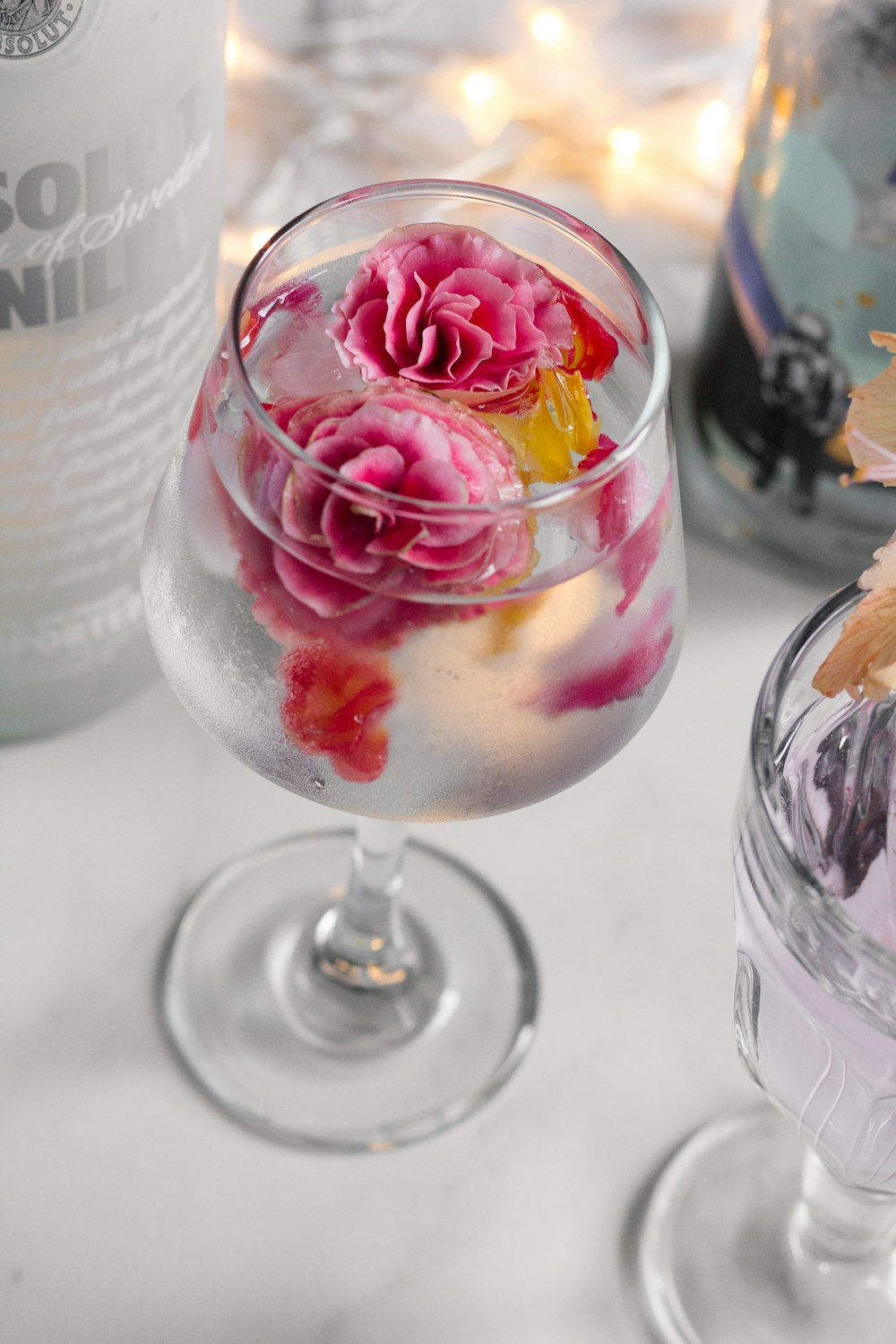 ice cream with strawberry and raspberry on clear glass cup