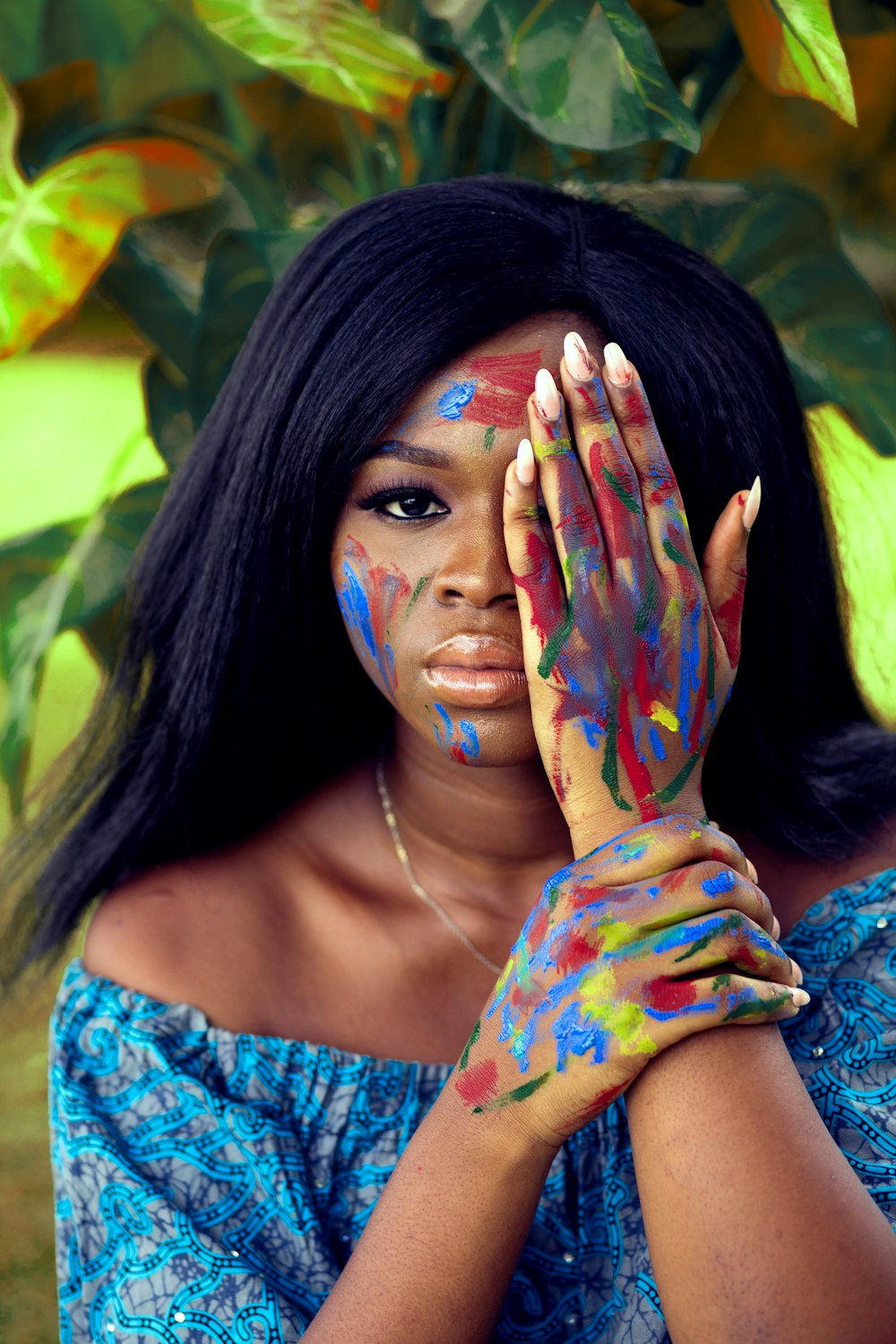 woman with blue and red paint on face