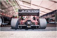 The racing team preparing Jorge Solís's car in the pit lane.