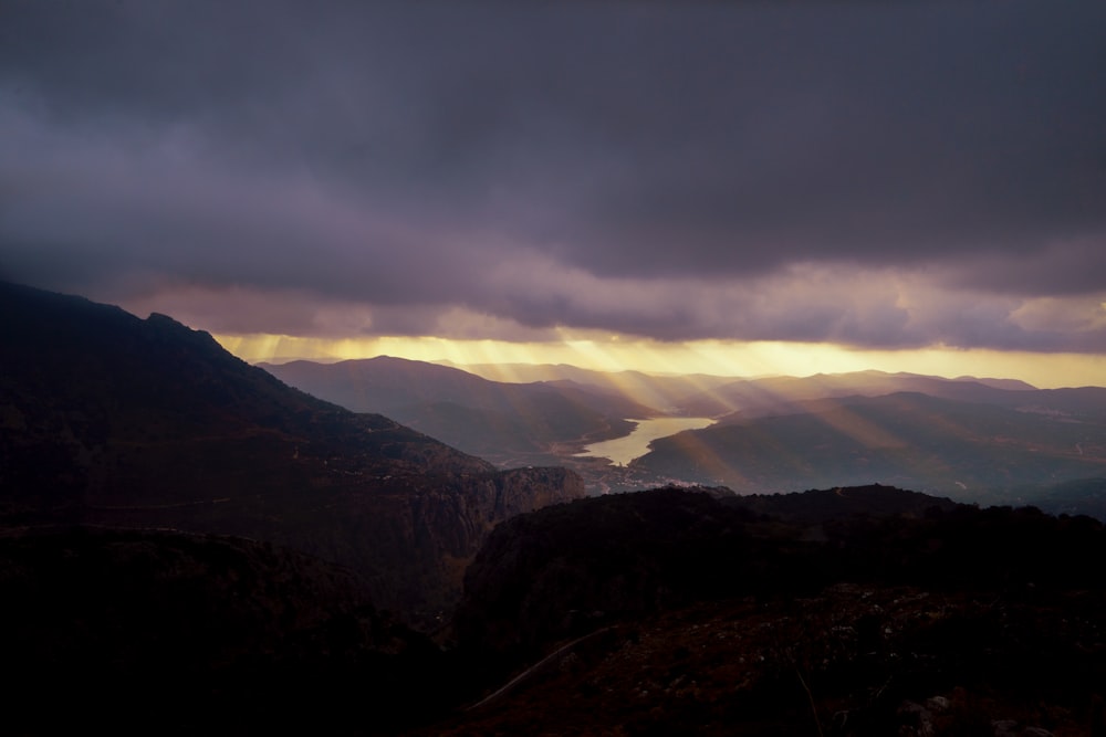 mountains under white clouds during daytime