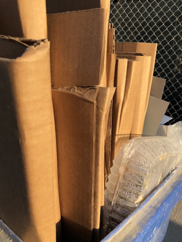 Biodegradable boxes stacked neatly in a natural setting.