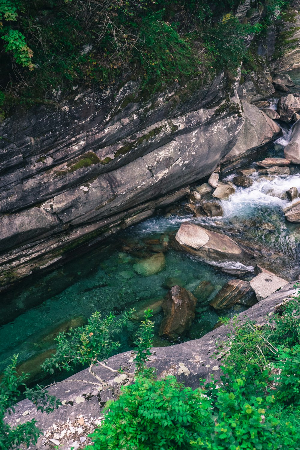 brown rock formation beside river