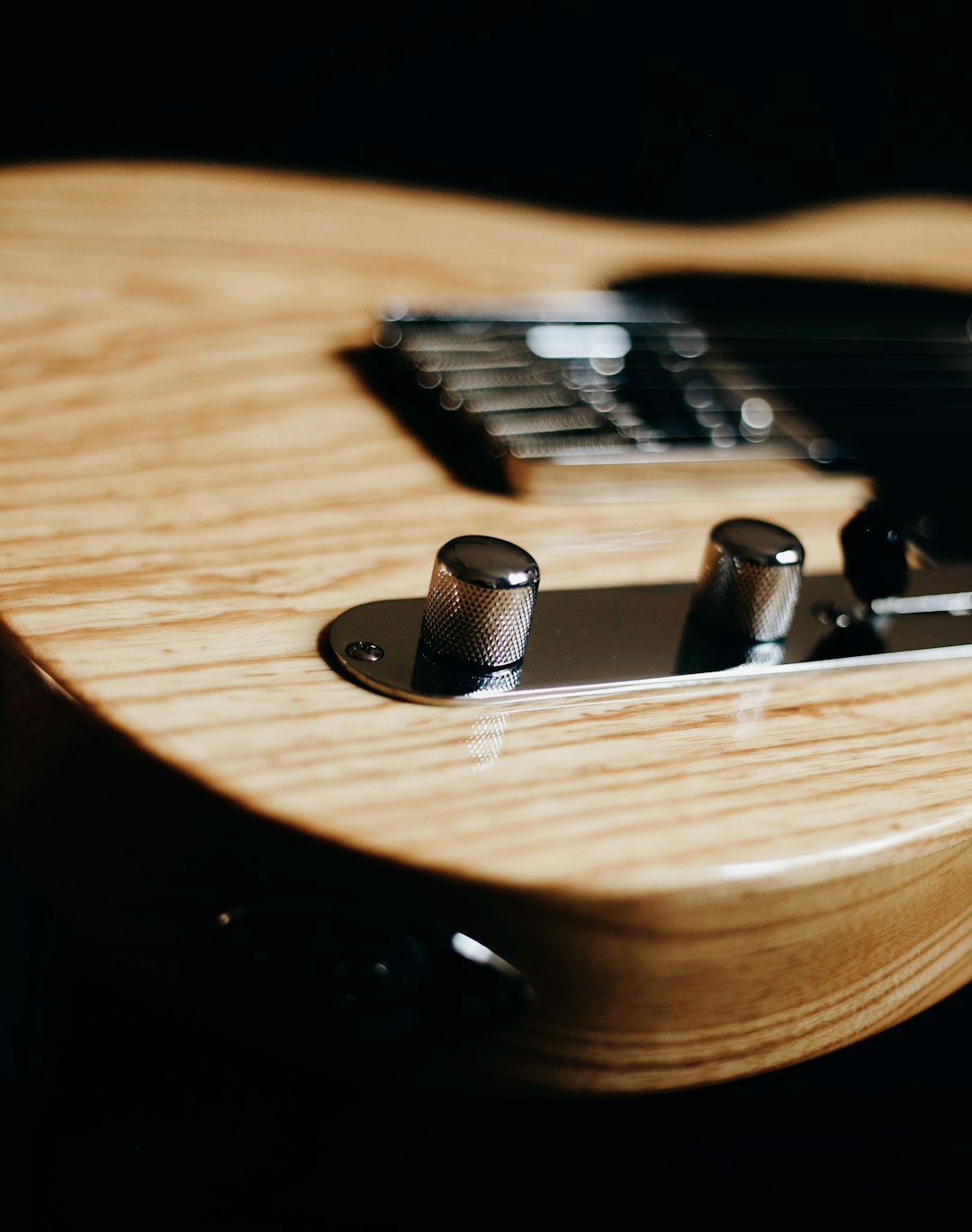 brown and black guitar pick