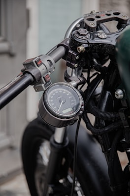Close-up of a rider’s hands on motorcycle handles emphasizing focus and care