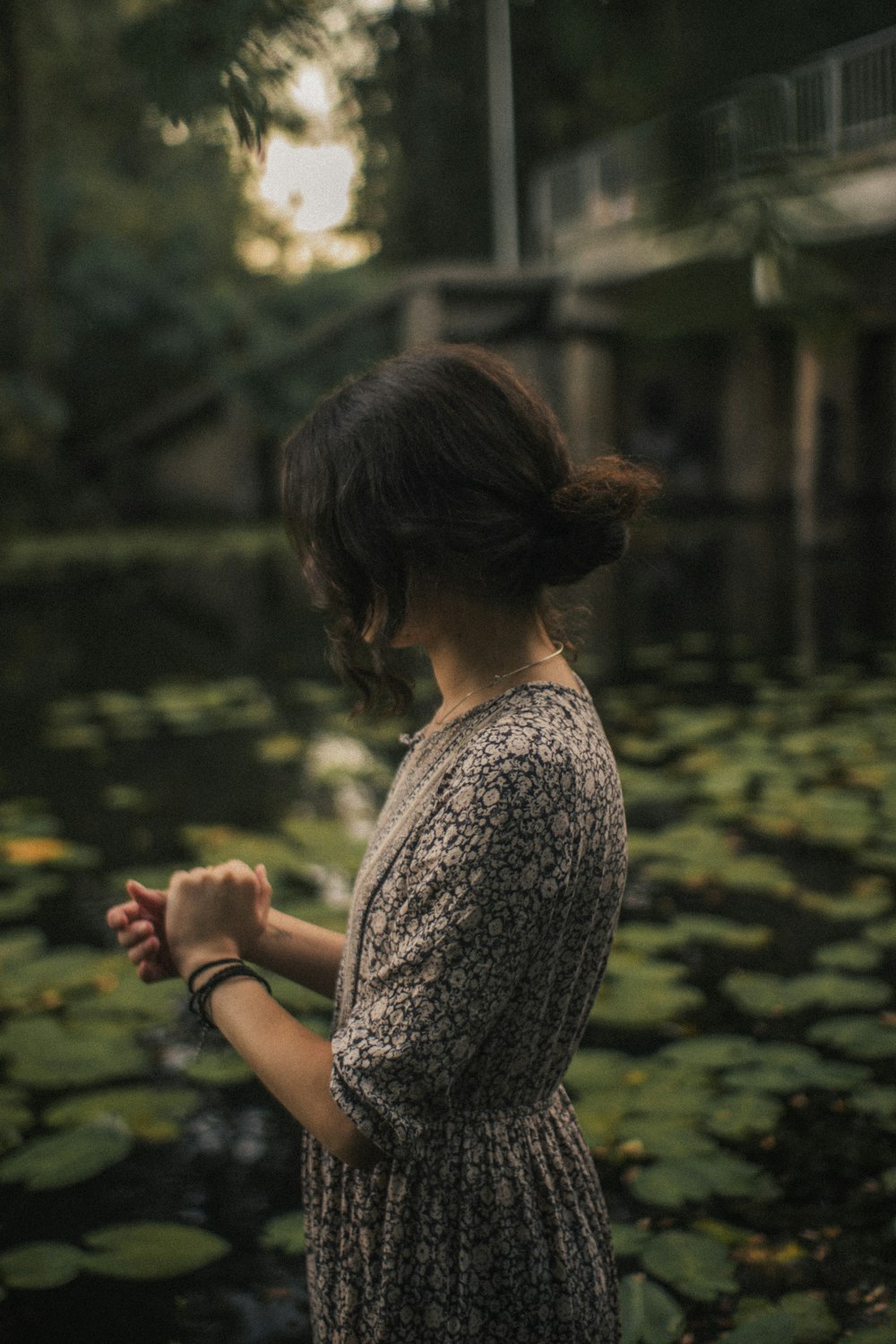 woman in grey shirt sitting on ground