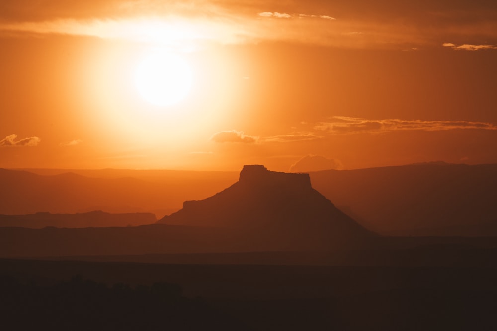 silhouette of mountain during sunset