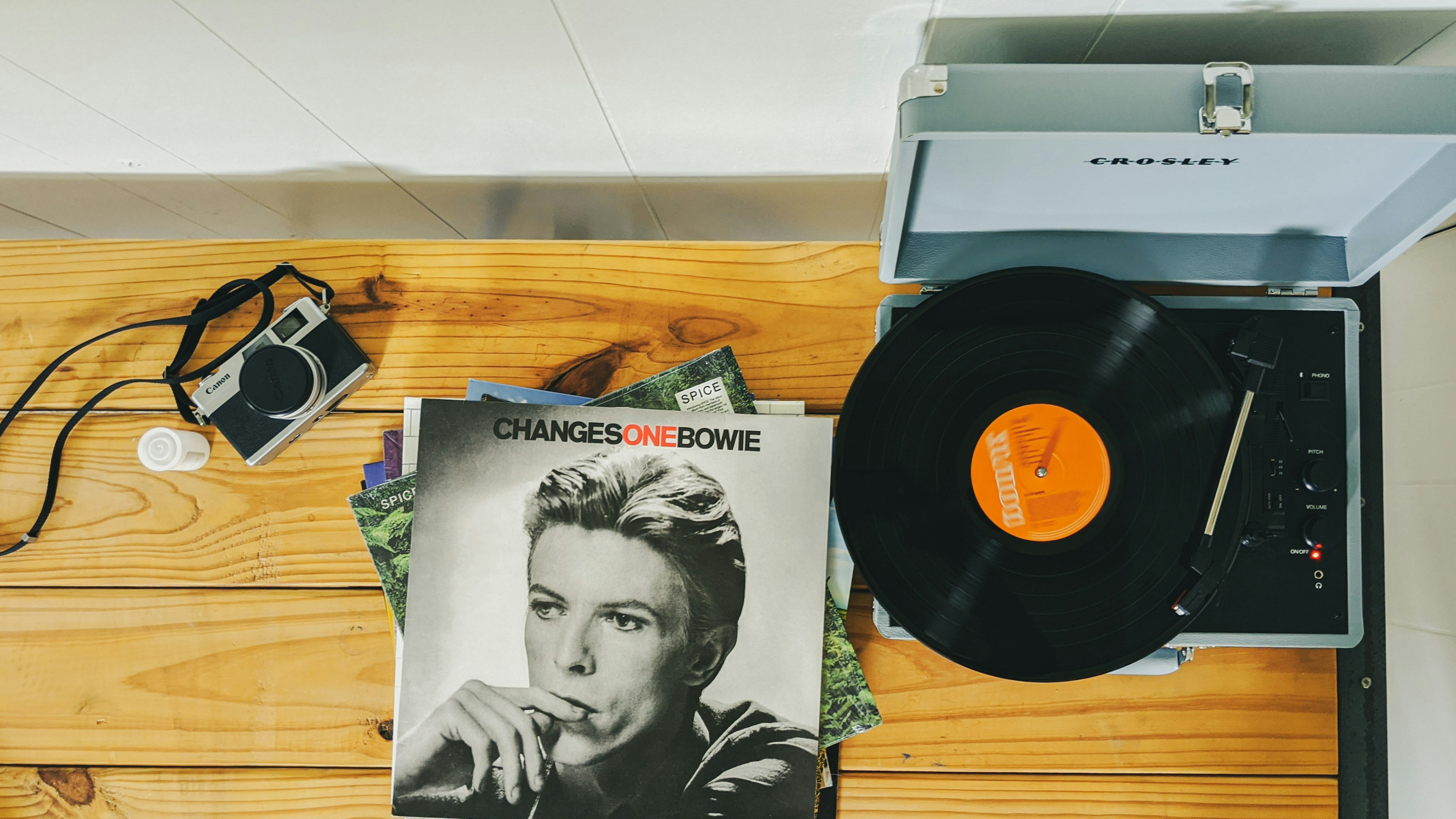 vinyl record on brown wooden table