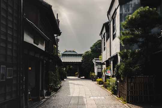 gray concrete road between houses under gray sky during daytime in Kawagoe Japan