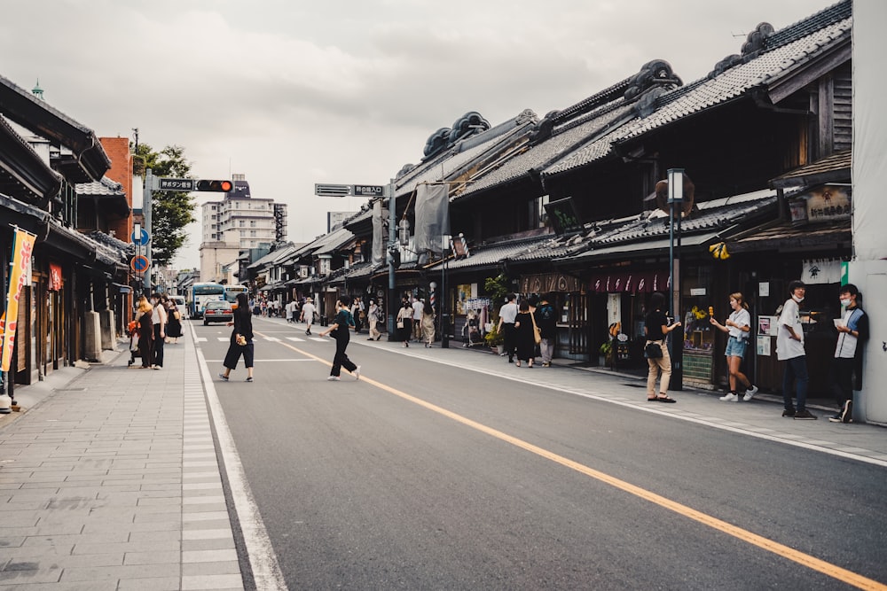 people walking on street near buildings during daytime