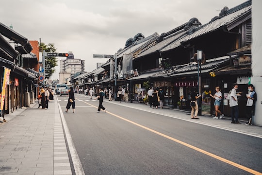 people walking on street near buildings during daytime in Kawagoe Japan