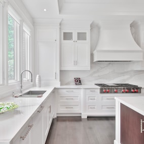 white wooden kitchen cabinet and sink