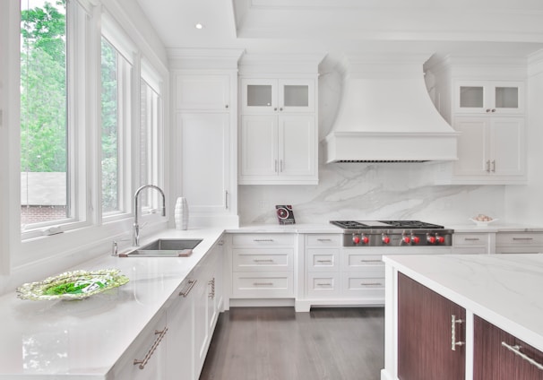 white wooden kitchen cabinet and sink