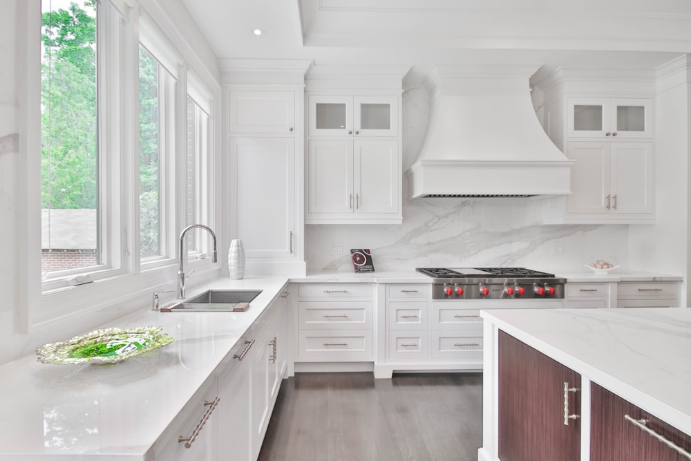 white wooden kitchen cabinet and sink
