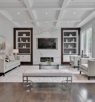 white wooden coffee table near white sofa